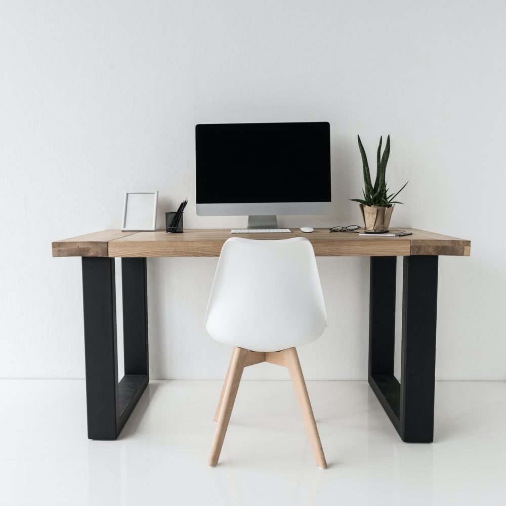 workplace-with-computer-and-stylish-furniture-in-modern-office